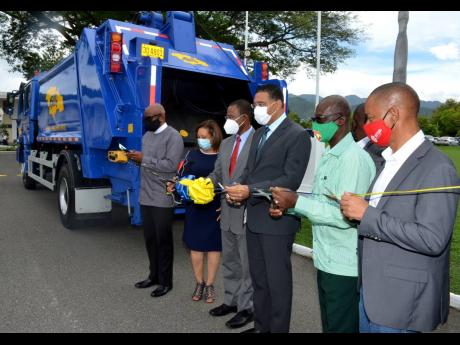 PM Hands Over 20 New Garbage Trucks To NSWMA